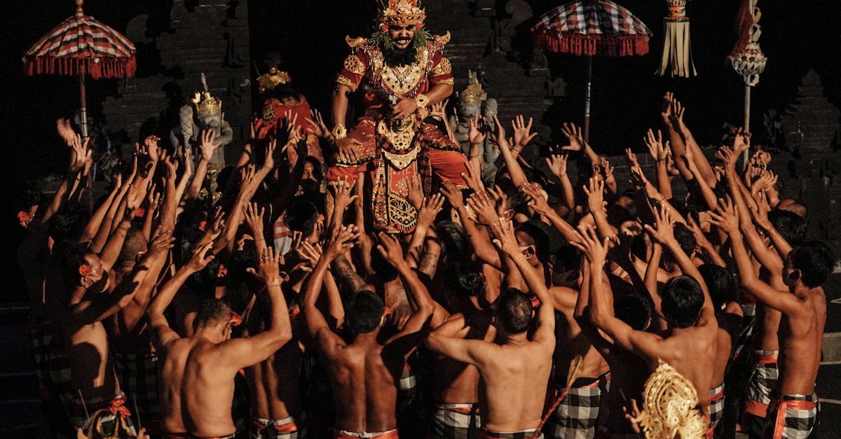 Vibrant Kecak dance ceremony with dancers in traditional attire at night in Bali.